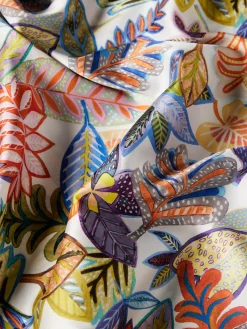 MULHER LION OF PORCHES Blusas^Blusa estilo poncho com padrão tropical